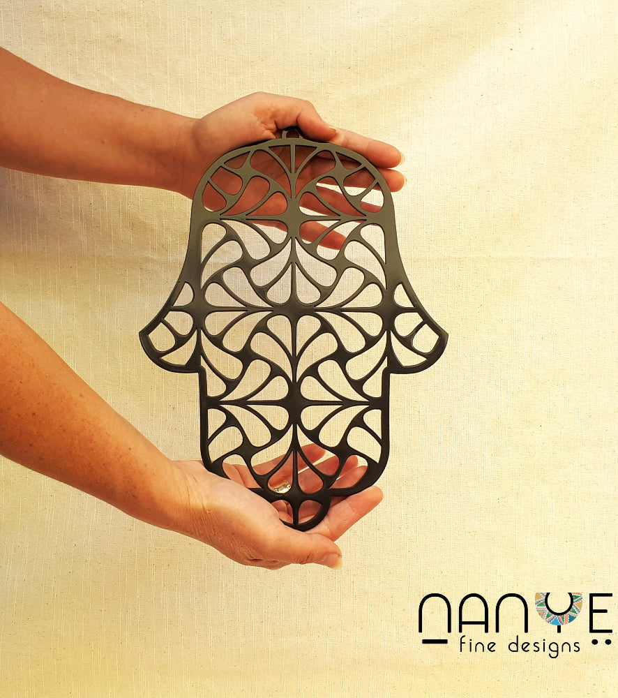 Handmade black Hamsa wall hanging from Israel, spiritual metal home decor for protection and good luck