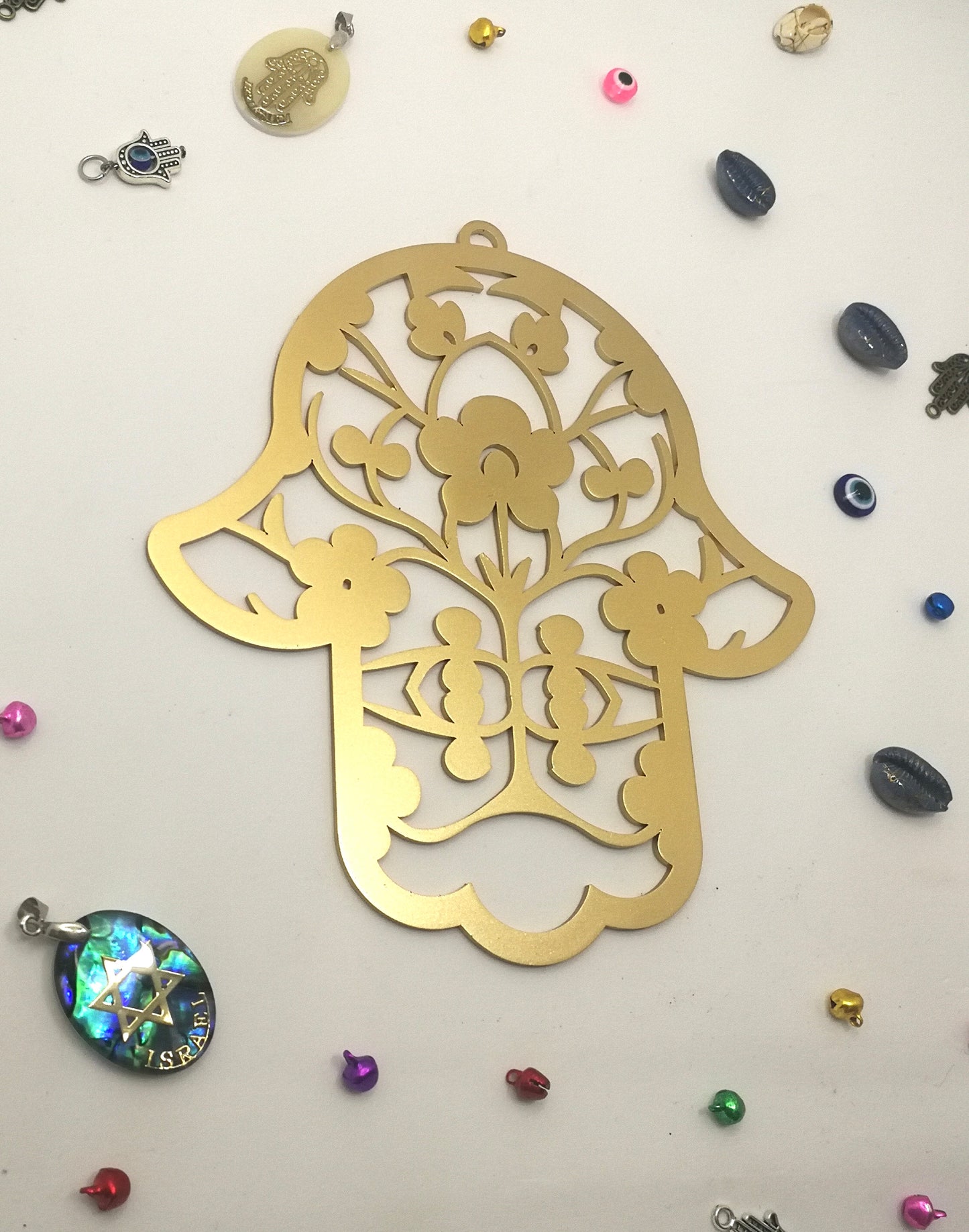 Israeli handmade Hamsa wall art with geometric metal design in gold