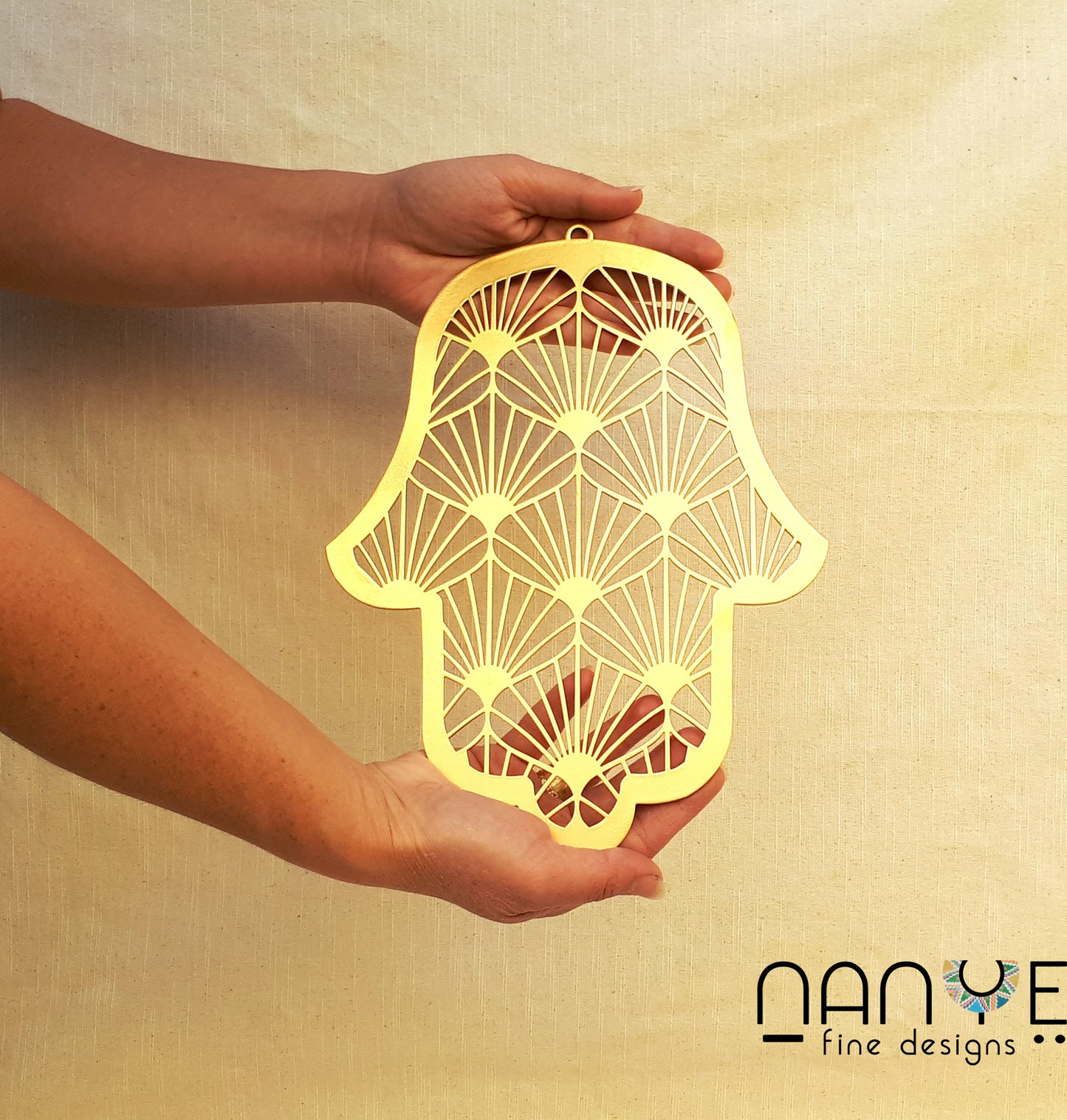 Handmade Gold Hamsa wall hanging from Israel, spiritual metal home decor for protection and good luck