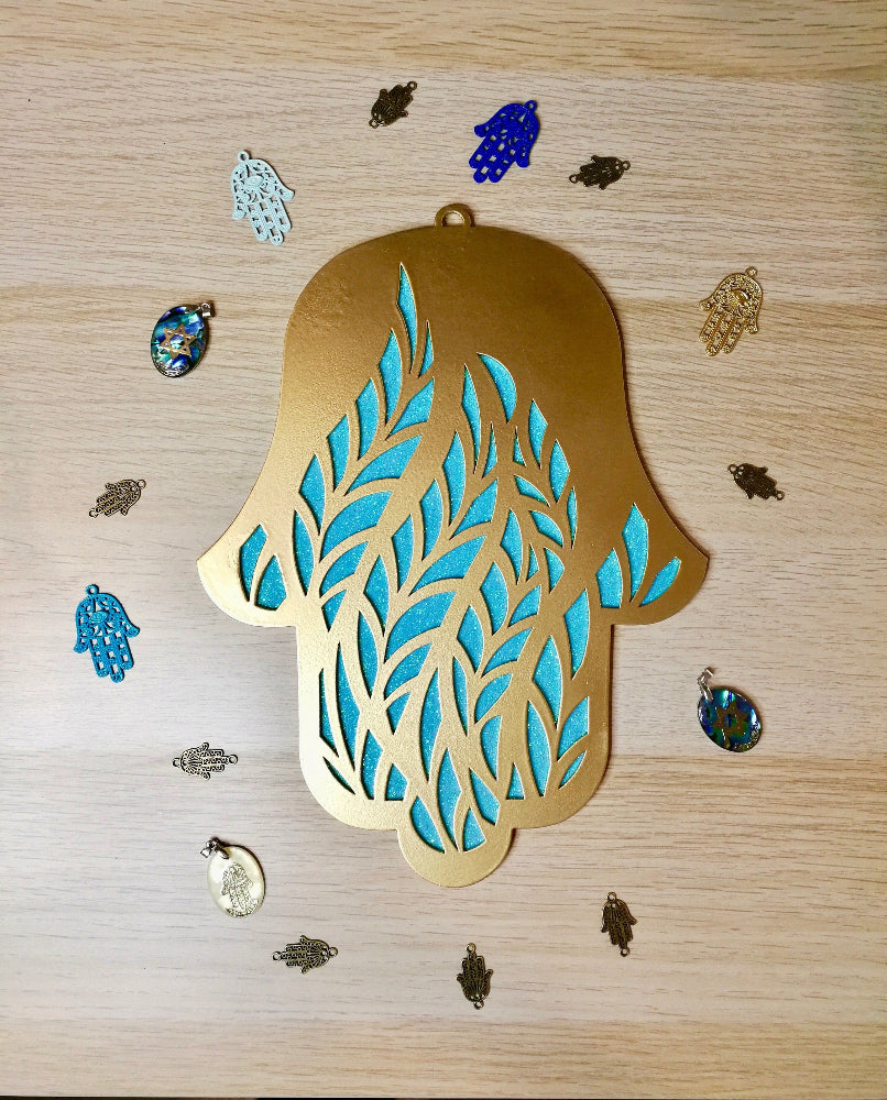 Handmade gold Hamsa wall hanging from Israel, spiritual metal home decor for protection and good luck