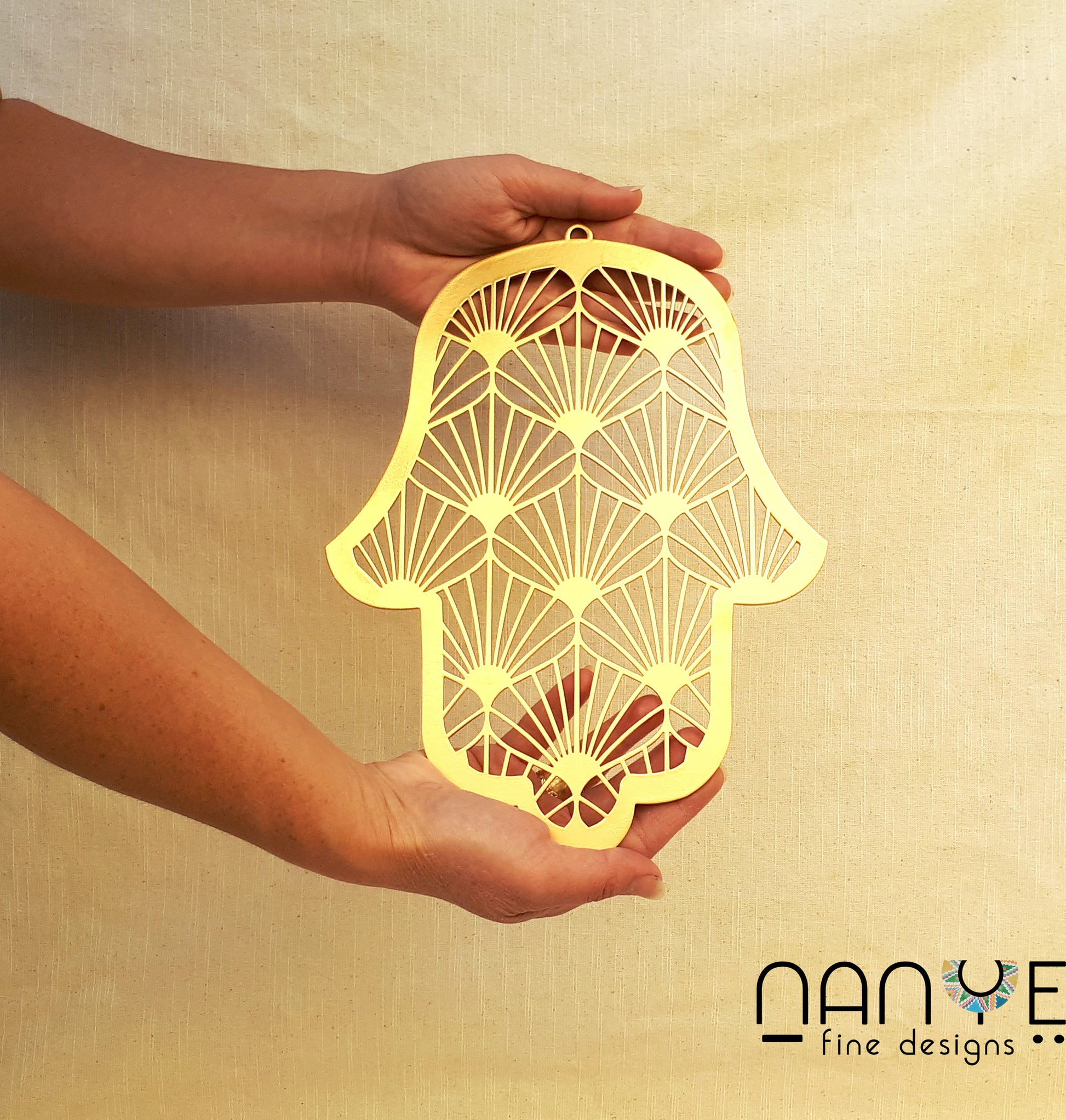 Handmade Gold Hamsa wall hanging from Israel, spiritual metal home decor for protection and good luck