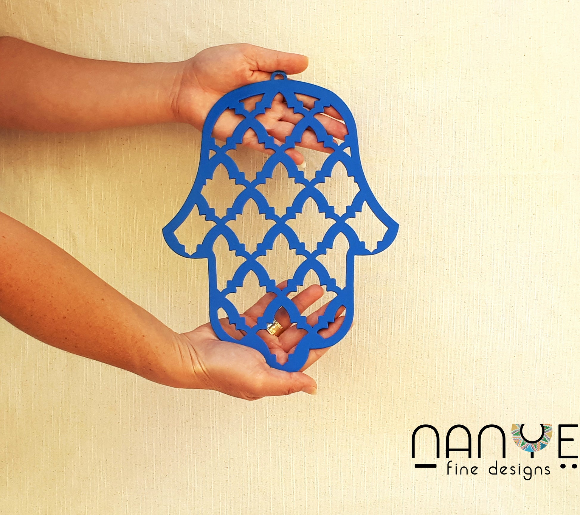 Handmade blue Hamsa wall hanging from Israel, spiritual metal home decor for protection and good luck