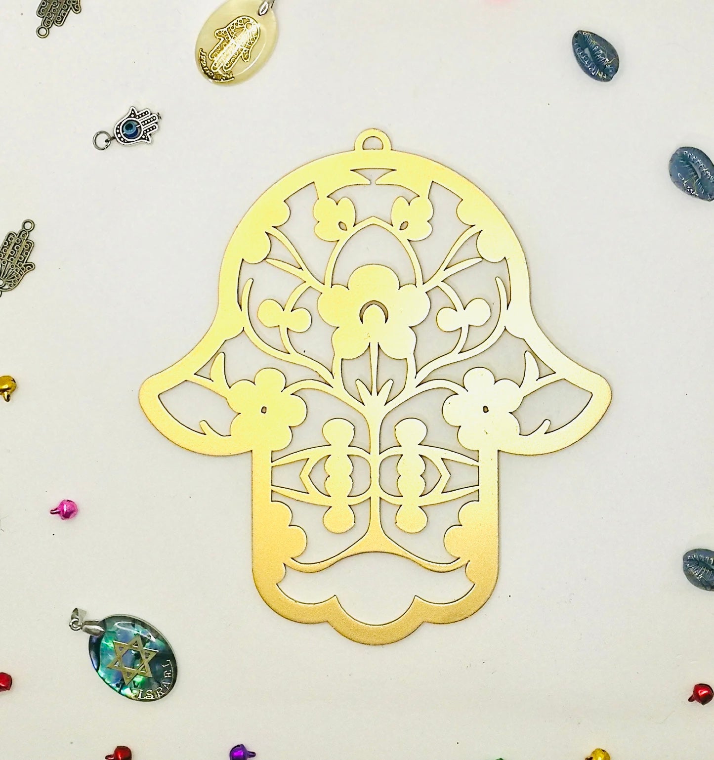 Handmade gold Hamsa wall hanging from Israel, spiritual metal home decor for protection and good luck