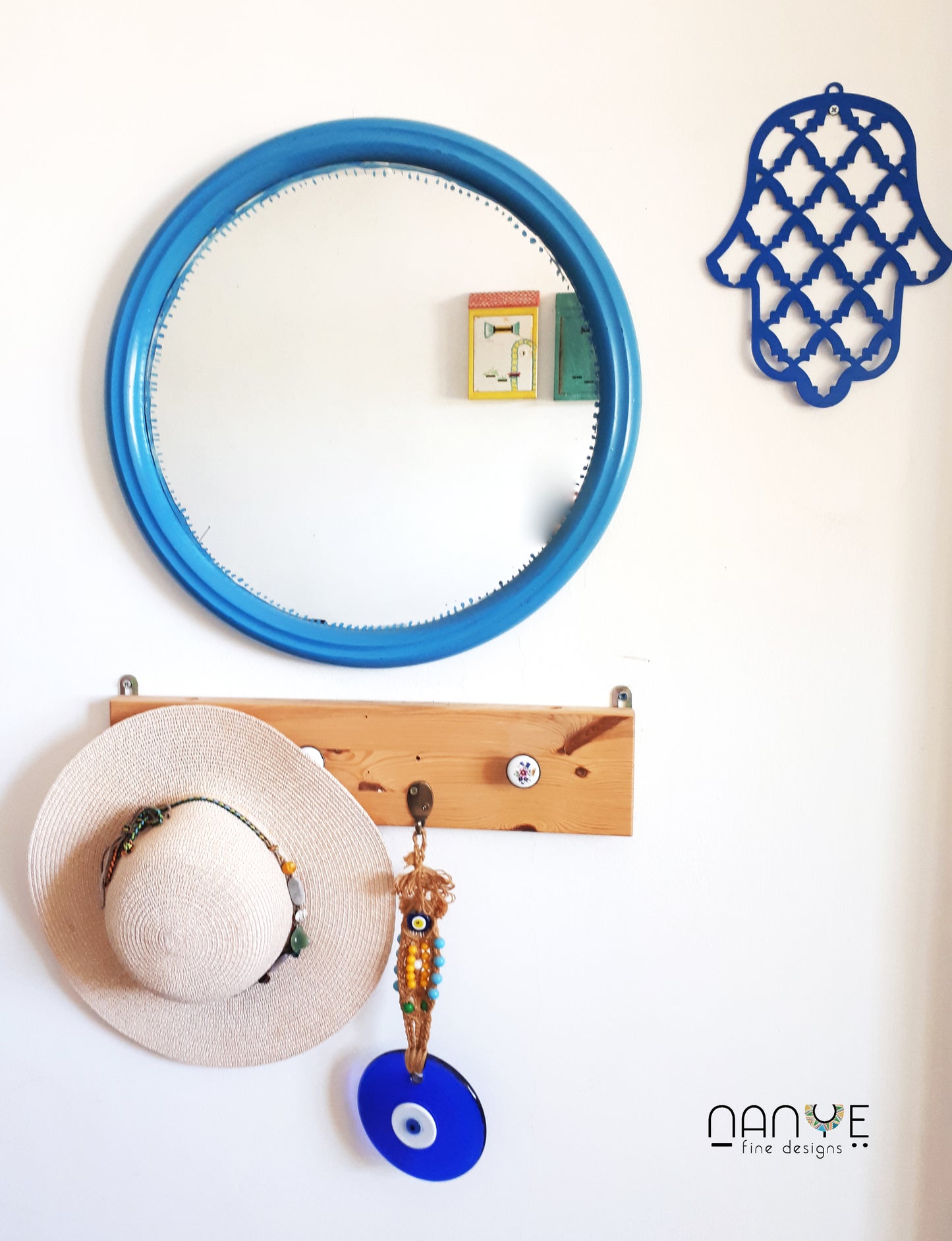 Handmade Israeli Hamsa wall decor displayed as spiritual home protection art