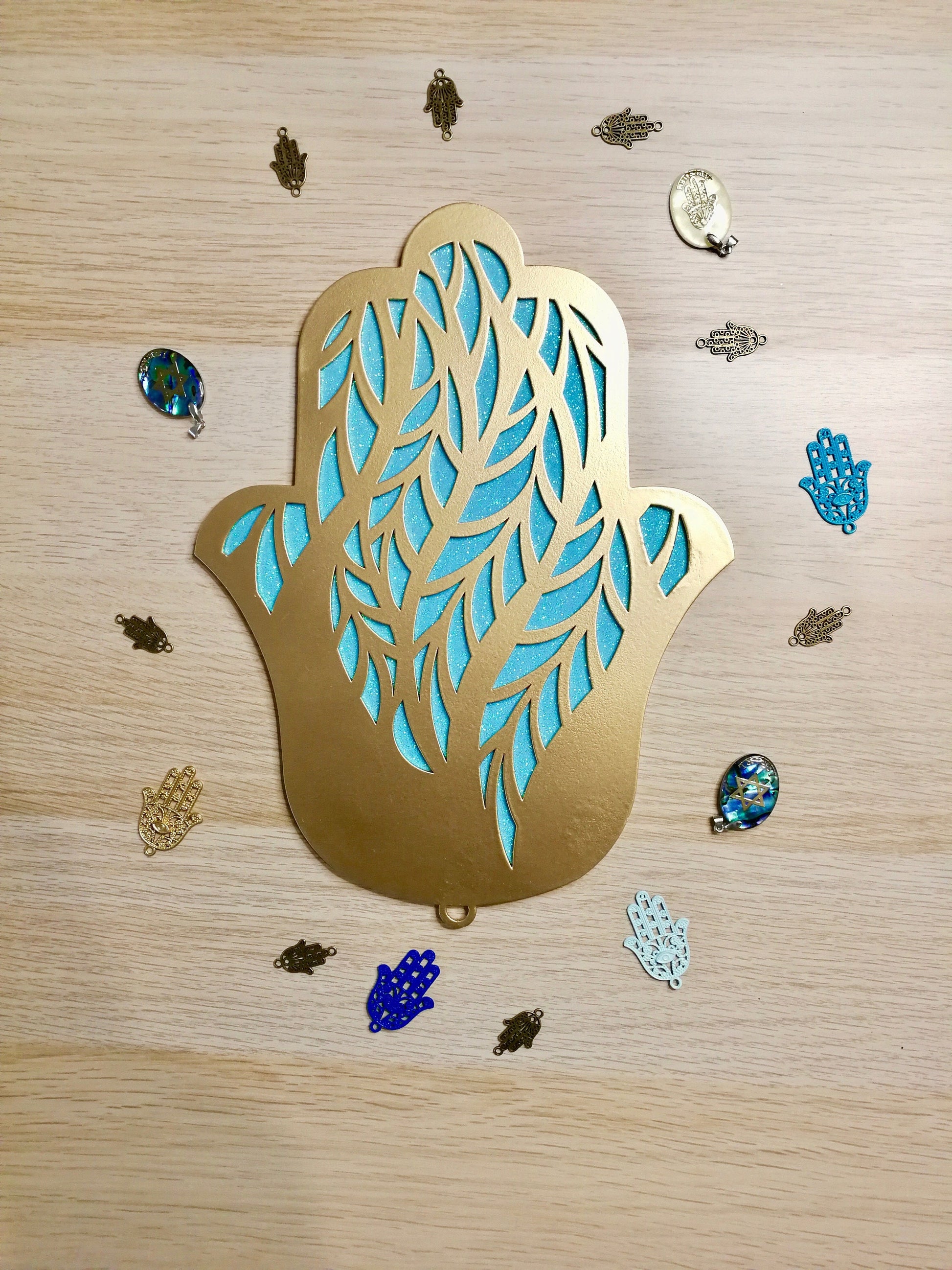 Israeli handmade Hamsa wall art with geometric metal design in gold