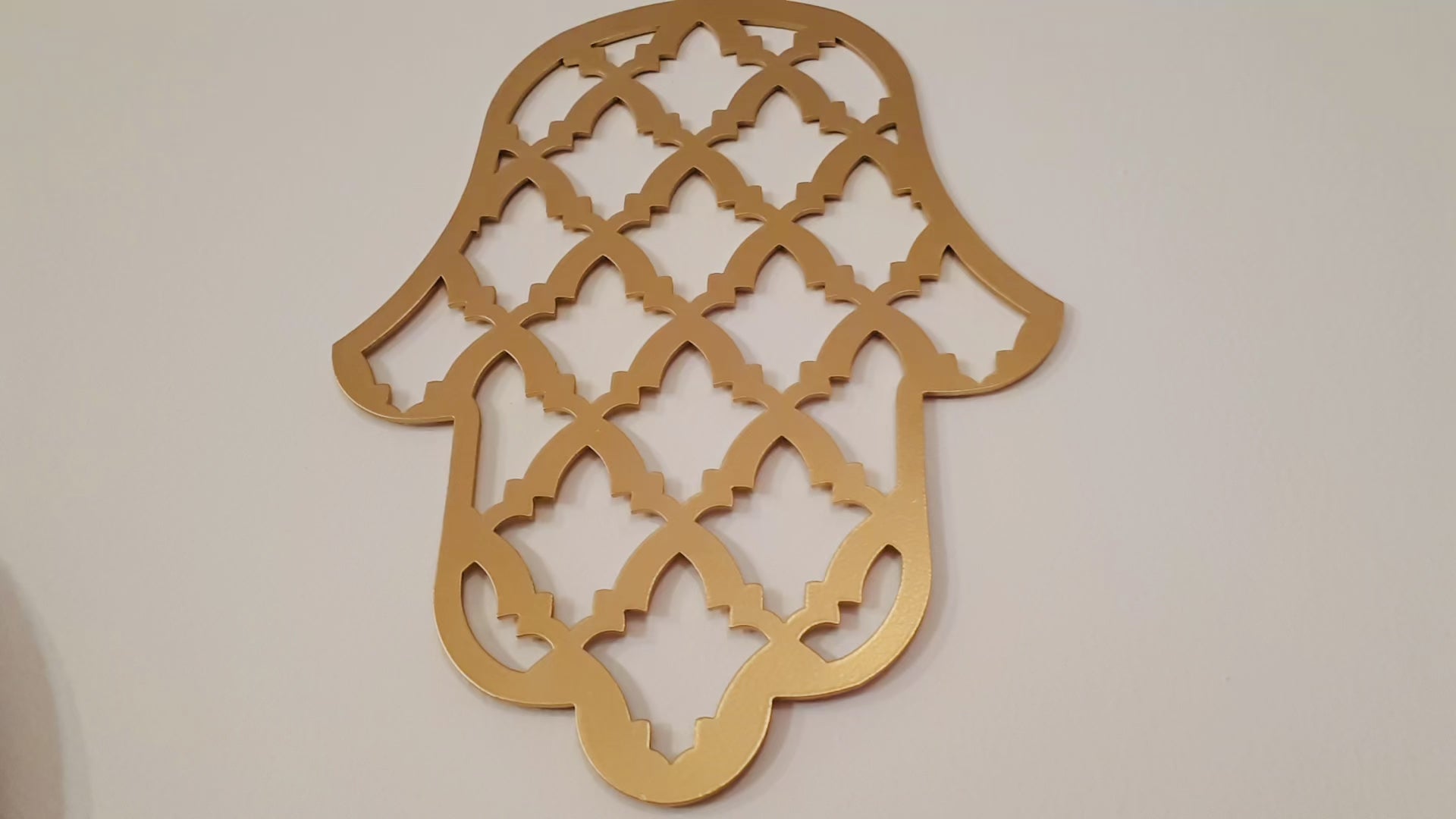 Load video: Handmade Metal Hamsa Wall Art from Israel – Gold Hamsa Decor